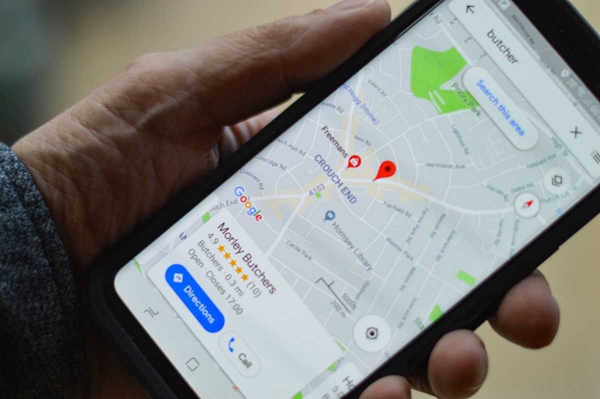 A homeowner searching Google Maps on a phone